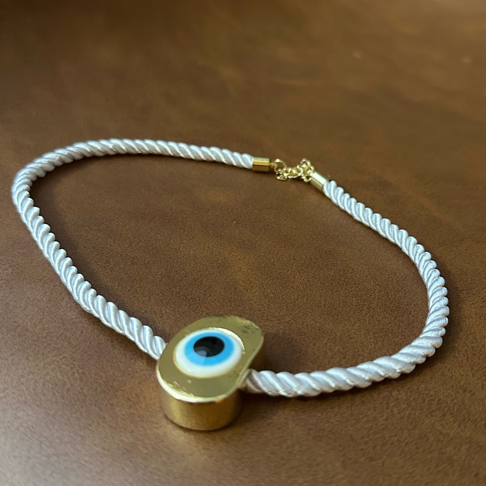 evil eye on gold pendant on white soft rope necklace - Picture 4 of 5